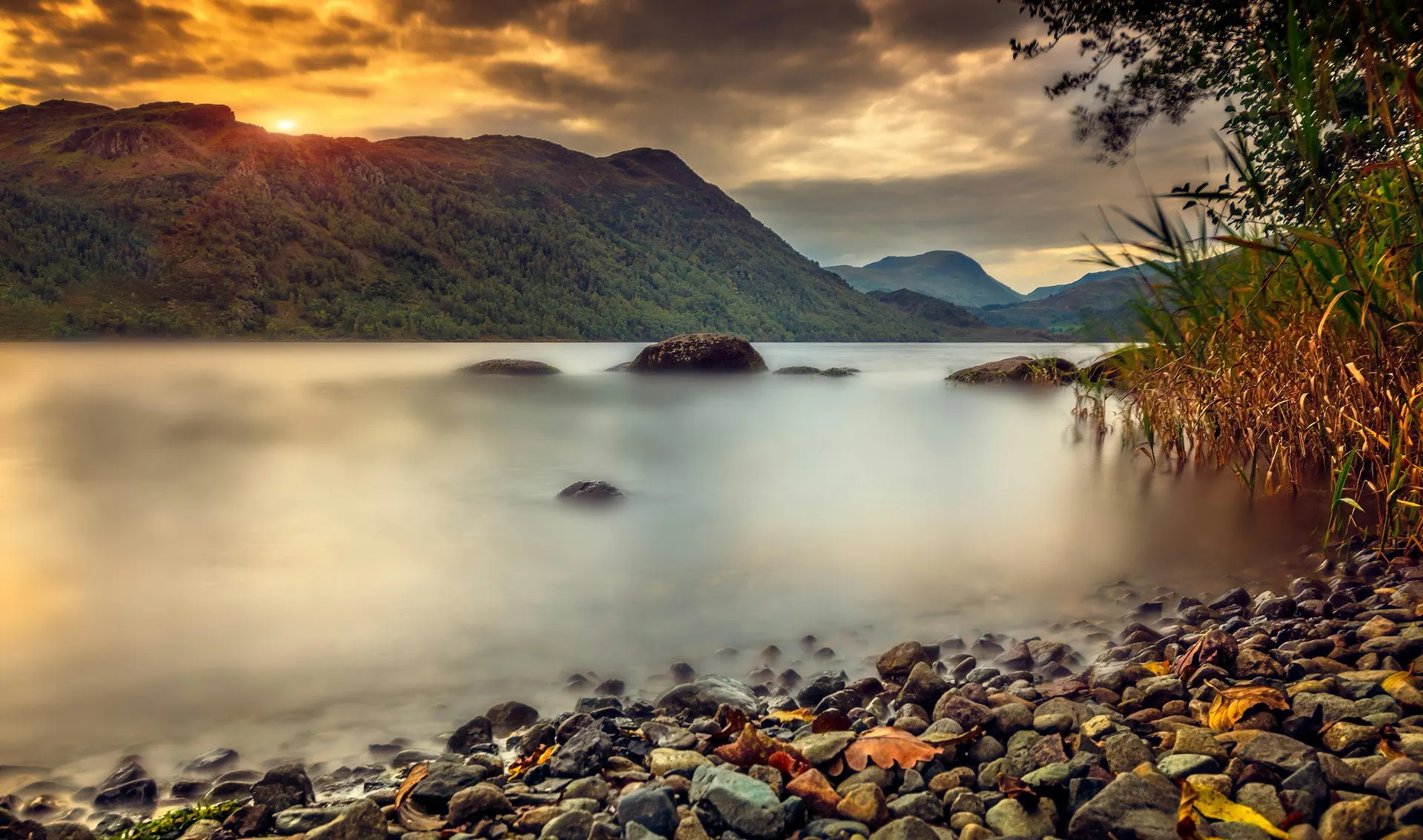 Calm Lake District water and fell scenery in England